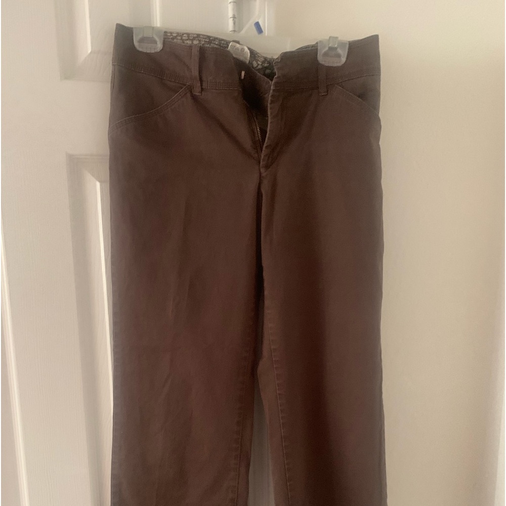 Brown pants. Clasp and button to close.